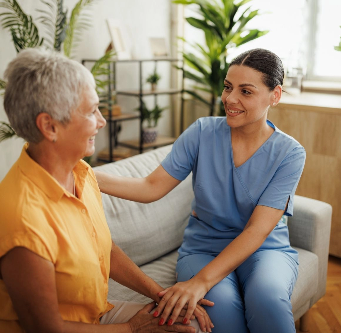 Caregiver providing assistance to a senior
