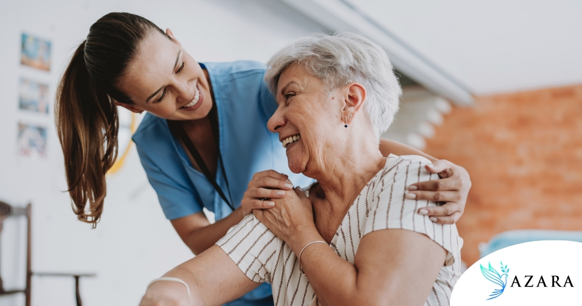 A female caregiver helping an older woman with stroke recovery at home.